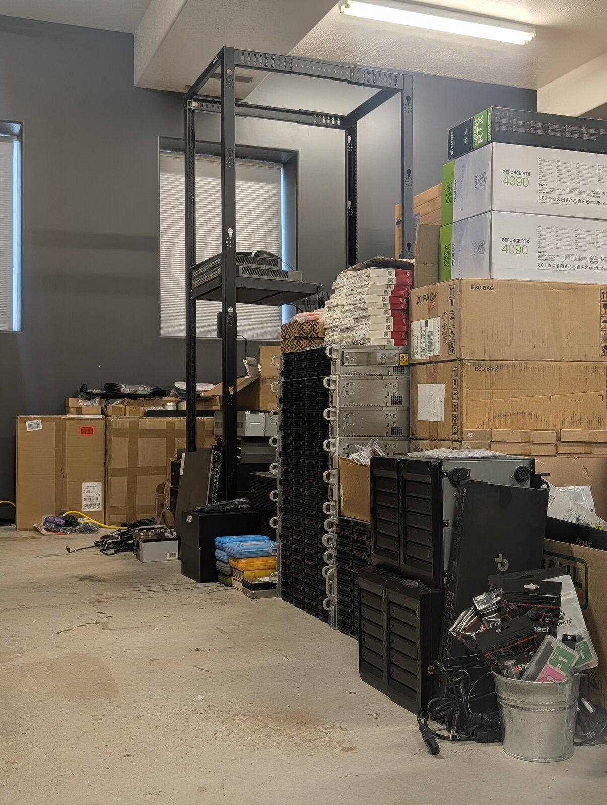 Hardware waiting - empty rack and stacked servers