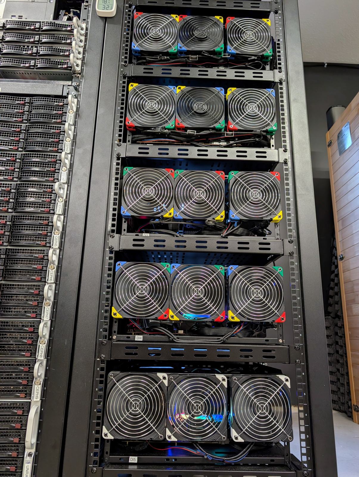 Rack 3 seen wide from the front, the fan trays of the GPU servers stacked down it, with the edge of rack 2 in frame
